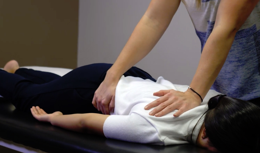 Image of a patient receiving physiotherapy treatment on thier back
